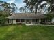 Charming single-story home with a manicured lawn, a welcoming porch, and attractive black shutters at 13612 11Th E Ter, Bradenton, FL 34212