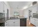 Kitchen showcasing granite countertops, stainless dishwasher, and breakfast nook at 13612 11Th E Ter, Bradenton, FL 34212