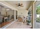 Enclosed patio with wicker seating and views into the home's living room at 13612 11Th E Ter, Bradenton, FL 34212