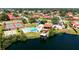 An aerial view of community amenities with a pool, tennis court, and a covered pier at 1431 57Th W St # 1431, Bradenton, FL 34209