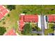 Birds-eye view highlights the red tile roofs, landscaping, and manicured lawns of the neighborhood homes at 1431 57Th W St # 1431, Bradenton, FL 34209