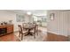 Dining area adjacent to kitchen with wood floors and neutral paint at 1431 57Th W St # 1431, Bradenton, FL 34209
