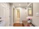 Hallway view with wood floors, white doors, and decorative mirror at 1431 57Th W St # 1431, Bradenton, FL 34209