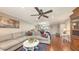 Inviting living room with hardwood floors, a large sectional sofa, and an open floor plan at 1431 57Th W St # 1431, Bradenton, FL 34209