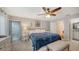 Cozy main bedroom with a comfortable bed, soft lighting, and tranquil ambiance at 1431 57Th W St # 1431, Bradenton, FL 34209