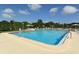 Large community pool with plenty of lounge chairs and seating areas at 1431 57Th W St # 1431, Bradenton, FL 34209