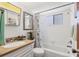 Bathroom features a shower-tub combo and vanity at 1535 Pleasant Rd # H5, Bradenton, FL 34207