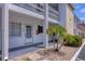 Condo building exterior showcasing unit 135, front entrance, and tropical landscaping at 1535 Pleasant Rd # H5, Bradenton, FL 34207