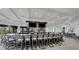 Well-lit bar area with ample seating, multiple televisions, and outdoor views at 17704 Gawthrop Dr # 102, Bradenton, FL 34211