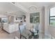Bright breakfast nook features a round glass table with seating for four, a pendant light and view at 17704 Gawthrop Dr # 102, Bradenton, FL 34211