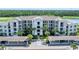 Spacious condo building with covered parking, balconies, and lush landscaping at 17704 Gawthrop Dr # 102, Bradenton, FL 34211