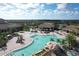 Stunning aerial view of the community pool showcasing its size, shape, and surrounding amenities at 17704 Gawthrop Dr # 102, Bradenton, FL 34211
