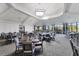 Elegant dining room with large windows, tray ceilings, and seating for large groups at 17704 Gawthrop Dr # 102, Bradenton, FL 34211