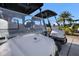 Close up of a golf cart with a view of palm trees in the background at 17704 Gawthrop Dr # 102, Bradenton, FL 34211