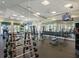Well-equipped weight training area with dumbbells, barbells, and mirror, suitable for any fitness level at 17704 Gawthrop Dr # 102, Bradenton, FL 34211