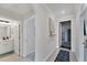 Neutral hallway with tile floors, with doorways to bathroom and other rooms at 17704 Gawthrop Dr # 102, Bradenton, FL 34211