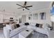 Bright living room seamlessly connects to a modern kitchen with ample seating and natural light at 17704 Gawthrop Dr # 102, Bradenton, FL 34211