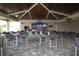 Relaxing outdoor bar area with ceiling fans and tables, perfect for entertaining and enjoying casual meals at 17704 Gawthrop Dr # 102, Bradenton, FL 34211