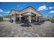 Covered outdoor dining area with tables and chairs, perfect for socializing and enjoying meals by the pool at 17704 Gawthrop Dr # 102, Bradenton, FL 34211