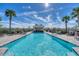 Relaxing poolside with a charming poolside gazebo, lounge chairs and serene views at 17704 Gawthrop Dr # 102, Bradenton, FL 34211