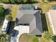 Aerial view showcasing the house, RV parking, and screened in pool at 18033 Edgewater Dr, Port Charlotte, FL 33948