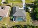 Aerial view of the backyard pool and deck area, with an RV parked on the driveway of the single-Gathering home at 18033 Edgewater Dr, Port Charlotte, FL 33948