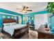 The primary bedroom has lots of natural light, a ceiling fan, and en-suite bath access at 18033 Edgewater Dr, Port Charlotte, FL 33948