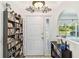 Bright foyer featuring a view of the window and a door to the living area at 18033 Edgewater Dr, Port Charlotte, FL 33948