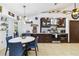 A fully equipped kitchen with stainless steel appliances, dark wood cabinetry, and marble countertops at 18033 Edgewater Dr, Port Charlotte, FL 33948