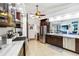 Modern kitchen features stainless steel appliances, marble countertops, and ample cabinet space at 18033 Edgewater Dr, Port Charlotte, FL 33948