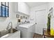 Clean and functional laundry room with modern washer and dryer at 18033 Edgewater Dr, Port Charlotte, FL 33948