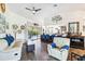 Bright open-plan living area with luxury vinyl plank flooring and views to the kitchen and pool at 18033 Edgewater Dr, Port Charlotte, FL 33948
