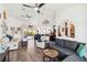 Open living room featuring vaulted ceilings, neutral walls, and sliders to the lanai and pool at 18033 Edgewater Dr, Port Charlotte, FL 33948