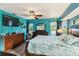 Bright, spacious bedroom with hardwood floors, ceiling fan, en-suite bath, and access to the outdoors at 18033 Edgewater Dr, Port Charlotte, FL 33948