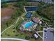 Aerial view of community pool, tennis courts and clubhouse at 208 Potenza Loop, Nokomis, FL 34275