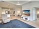 Open floor plan featuring a living room with a flat screen TV and adjacent dining area at 208 Potenza Loop, Nokomis, FL 34275