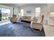 Open living room with comfortable seating and scenic views of the screened patio at 208 Potenza Loop, Nokomis, FL 34275