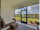 Screened patio offering serene views of a pond and landscaped surroundings at 208 Potenza Loop, Nokomis, FL 34275
