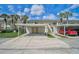Condo complex with covered parking featuring individual storage units and access to upper-level units via stairs at 208 Silver Lake Dr # 101, Venice, FL 34292