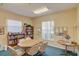 Cozy community room with ample seating and a well-stocked library at 208 Silver Lake Dr # 101, Venice, FL 34292