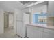 Bright kitchen with white appliances, cabinets, and neutral countertops, offering a clean and functional space at 208 Silver Lake Dr # 101, Venice, FL 34292