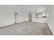 Spacious living area with open floor plan, large windows, and a view to the kitchen at 208 Silver Lake Dr # 101, Venice, FL 34292