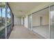 Enclosed patio offers outdoor living space with screened windows, and access to indoors at 208 Silver Lake Dr # 101, Venice, FL 34292