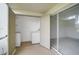 Patio features a laundry area and storage, with sliding door access to the indoors at 208 Silver Lake Dr # 101, Venice, FL 34292
