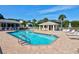 Community pool with a large deck and lounge chairs offers a great place to relax outdoors at 208 Silver Lake Dr # 101, Venice, FL 34292