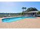 Inviting community pool surrounded by a brick paver deck is the perfect place to unwind at 208 Silver Lake Dr # 101, Venice, FL 34292