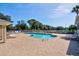 Community pool and patio featuring lounge chairs for relaxing under the clear blue sky at 208 Silver Lake Dr # 101, Venice, FL 34292