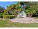 Charming neighborhood sign in a beautifully landscaped community at 208 Silver Lake Dr # 101, Venice, FL 34292