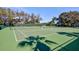 Well-maintained tennis courts offering an active lifestyle within the community on a sunny day at 208 Silver Lake Dr # 101, Venice, FL 34292