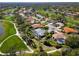 The house surrounded by greenery, a golf course and a pond in a beautiful neighborhood at 2196 Muskogee Trl, Nokomis, FL 34275